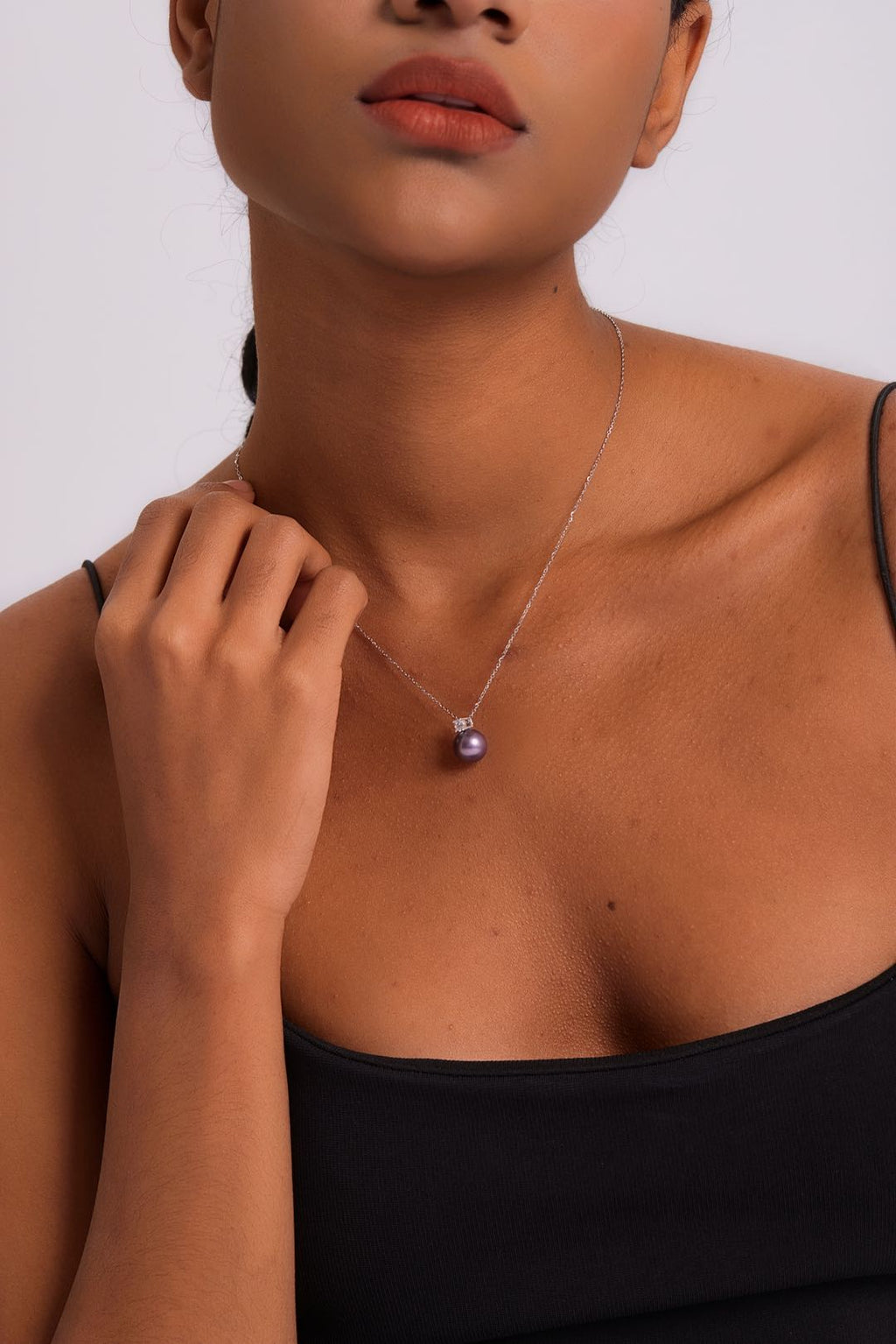 Model wearing Ethereal Amethyst pearl necklace at collarbone