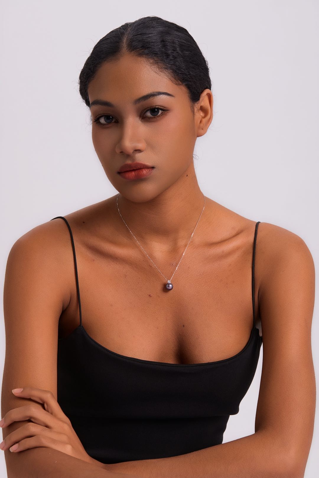 Model wearing Ethereal Amethyst pearl necklace at collarbone