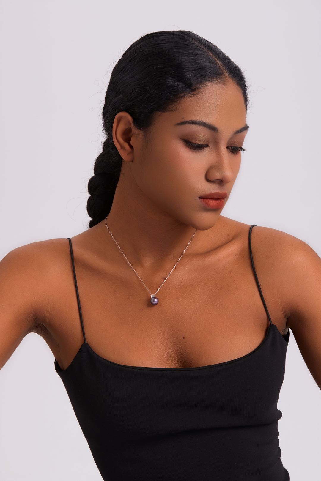 Model wearing Ethereal Amethyst pearl necklace at collarbone
