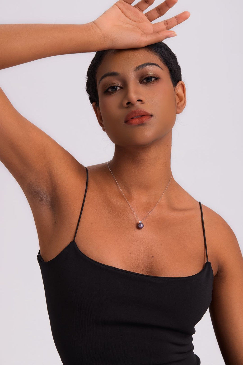 Model wearing Ethereal Amethyst pearl necklace at collarbone