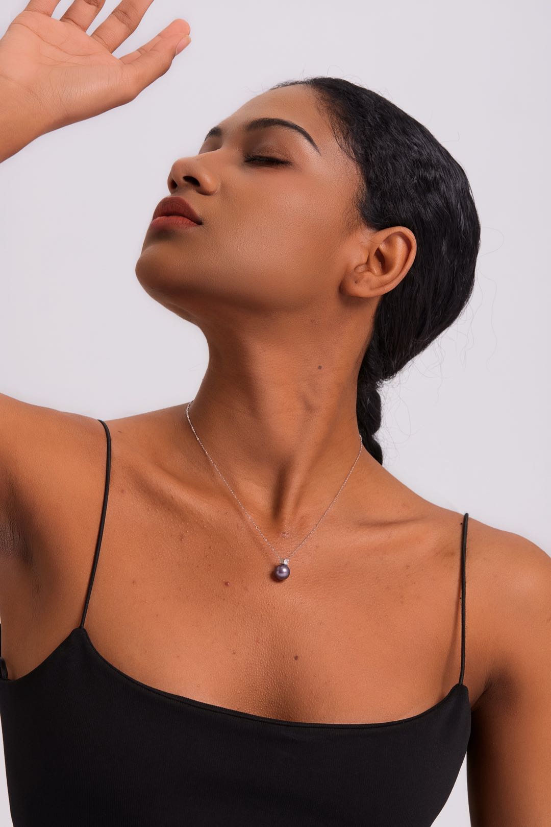 Model wearing Ethereal Amethyst pearl necklace at collarbone
