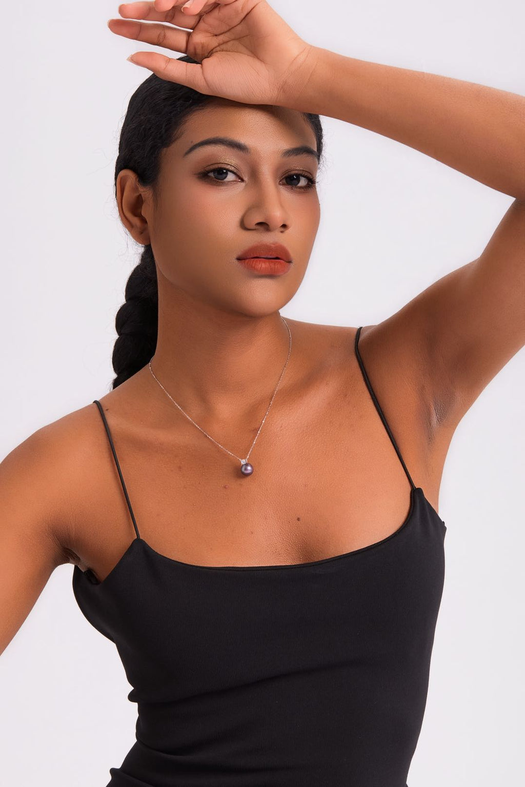 Model wearing Ethereal Amethyst pearl necklace at collarbone