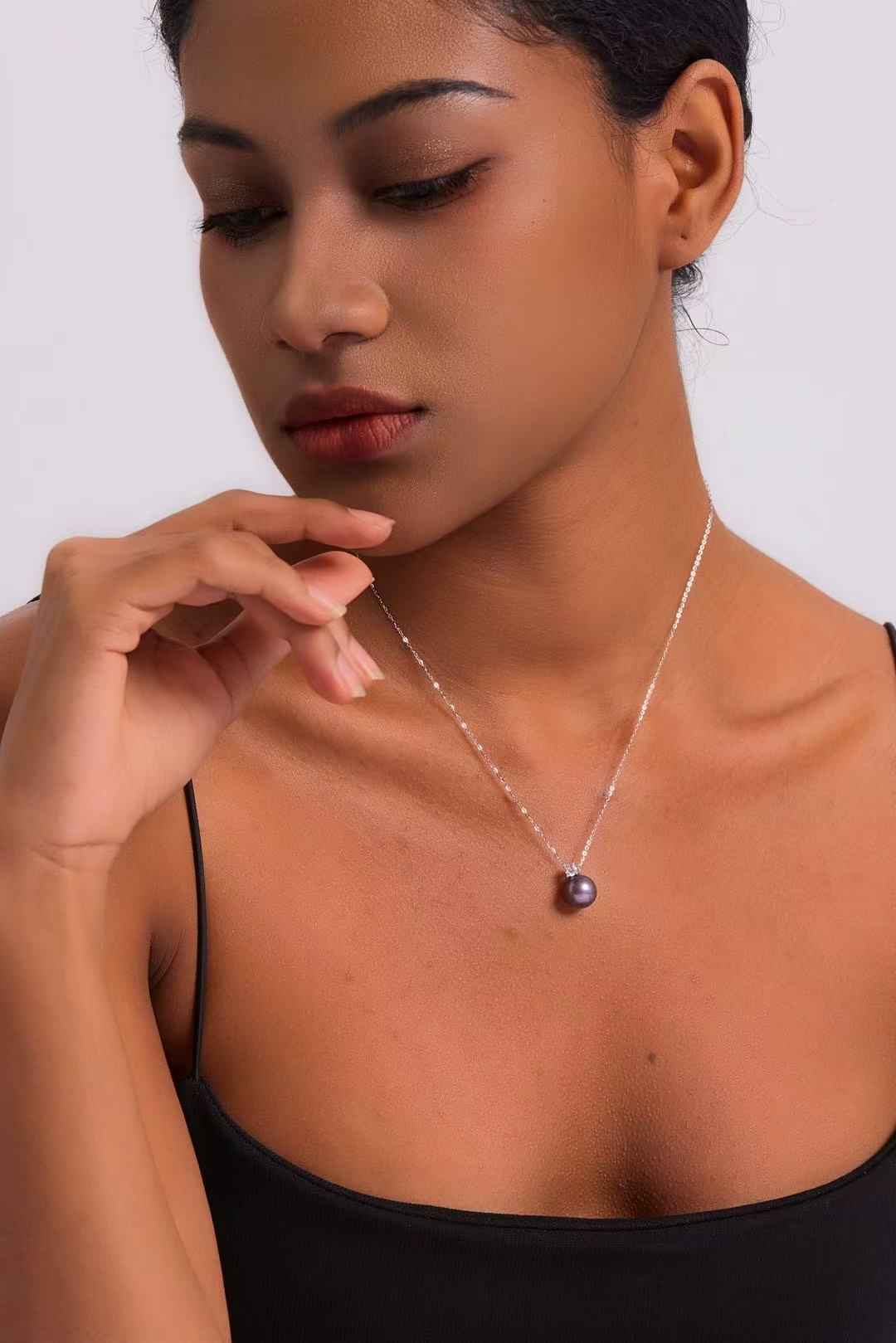 Model wearing Ethereal Amethyst pearl necklace at collarbone