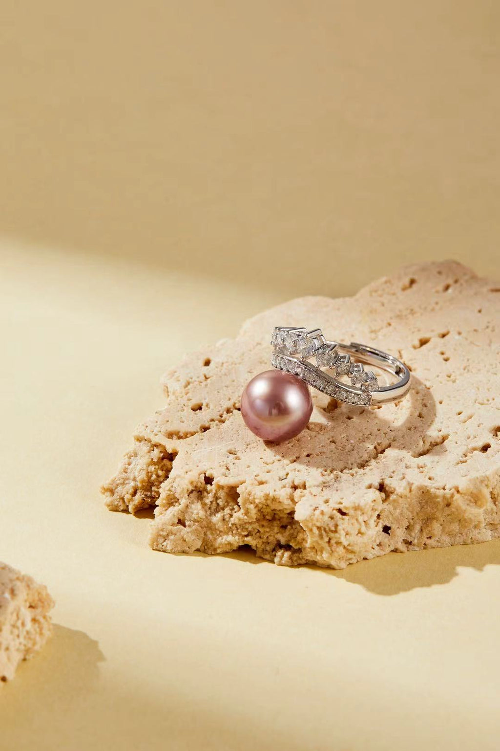 Lavender-pink iridescent pearl with sparkling CZ halo close-up