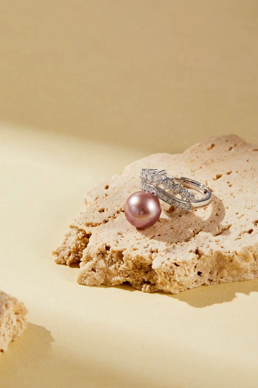 Lavender-pink iridescent pearl with sparkling CZ halo close-up