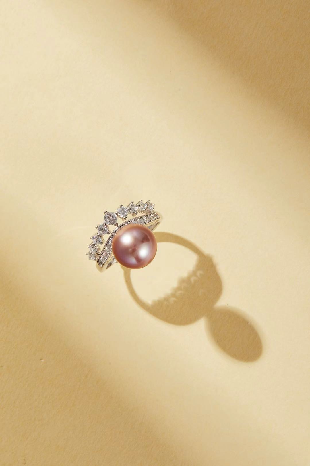 Lavender-pink iridescent pearl with sparkling CZ halo close-up