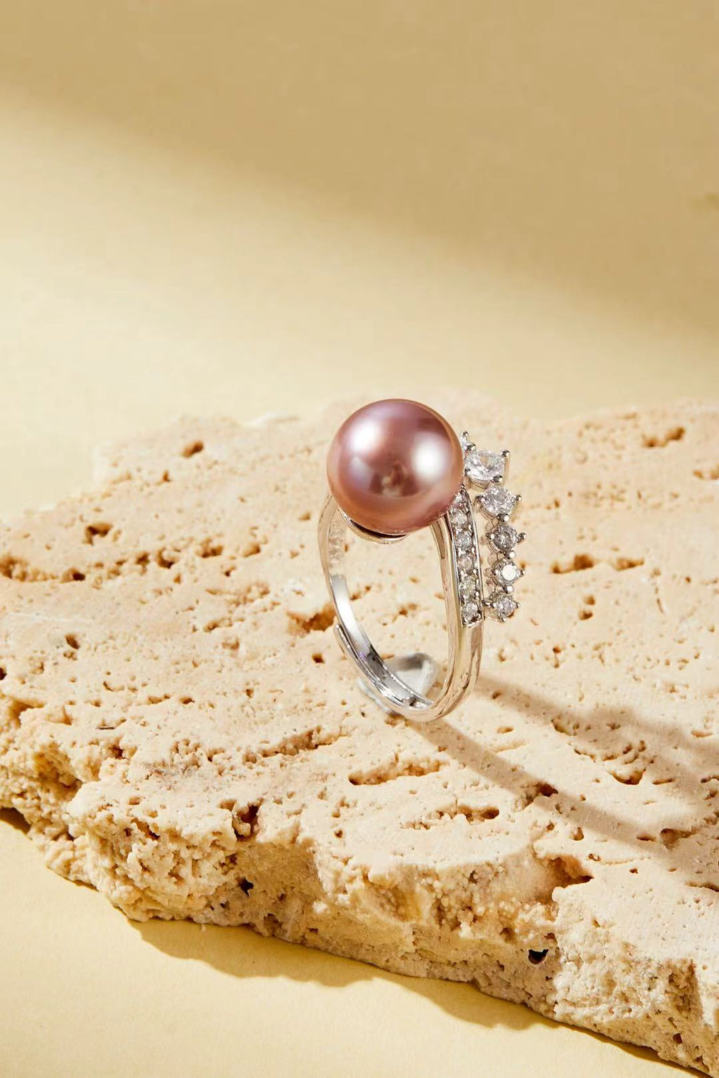 Lavender-pink iridescent pearl with sparkling CZ halo close-up