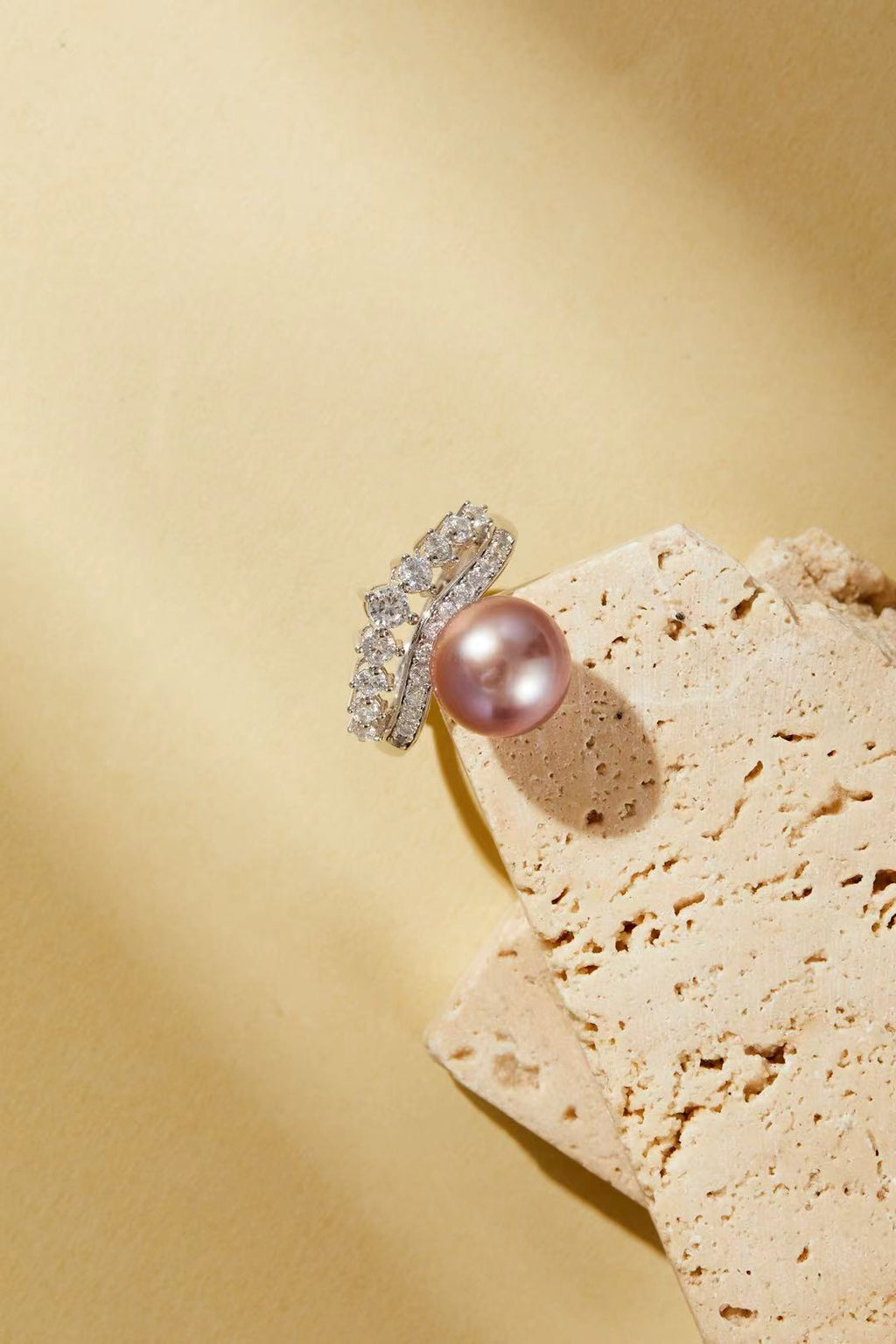 Lavender-pink iridescent pearl with sparkling CZ halo close-up