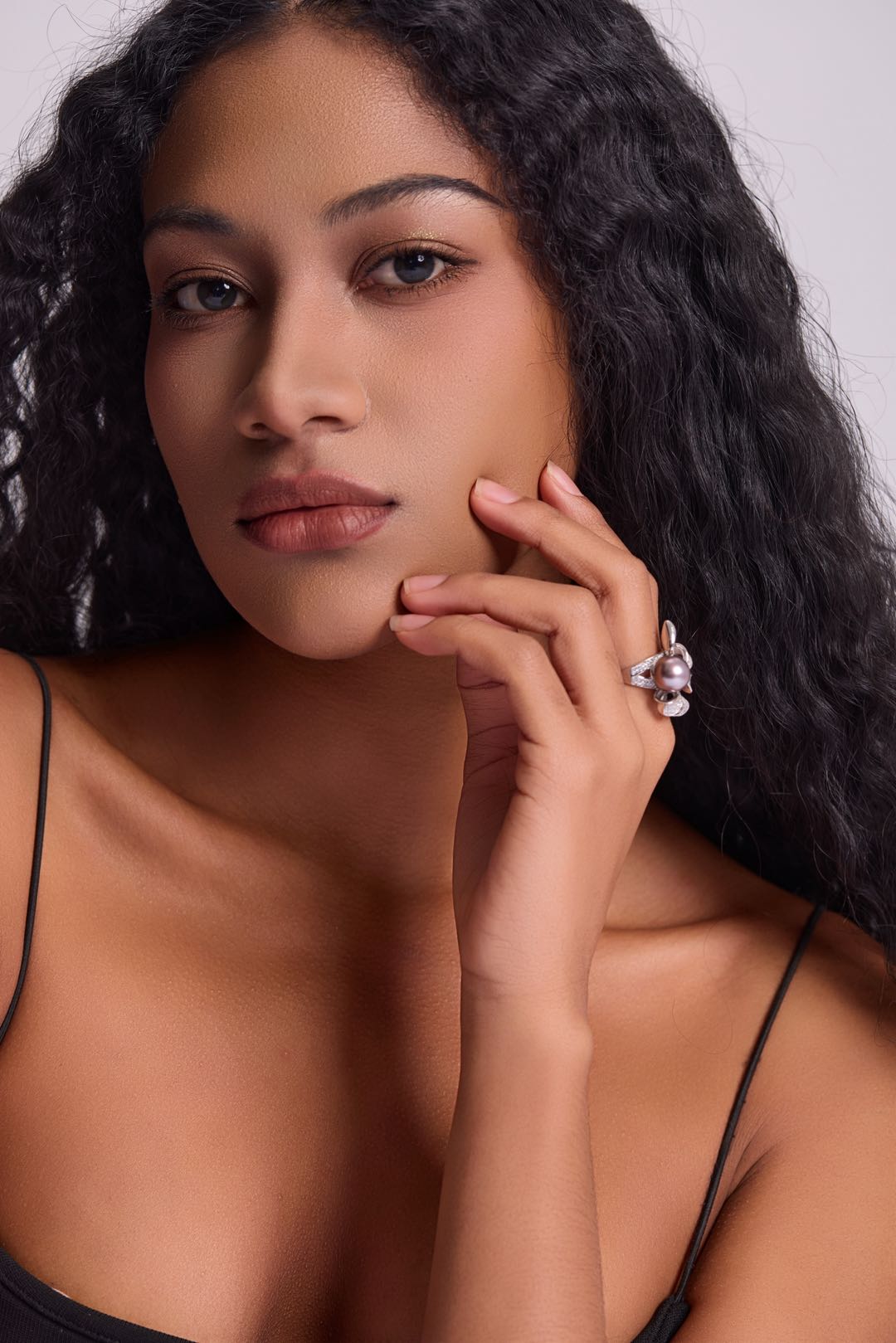 Model wearing Violet Bow pearl ring with little black dress