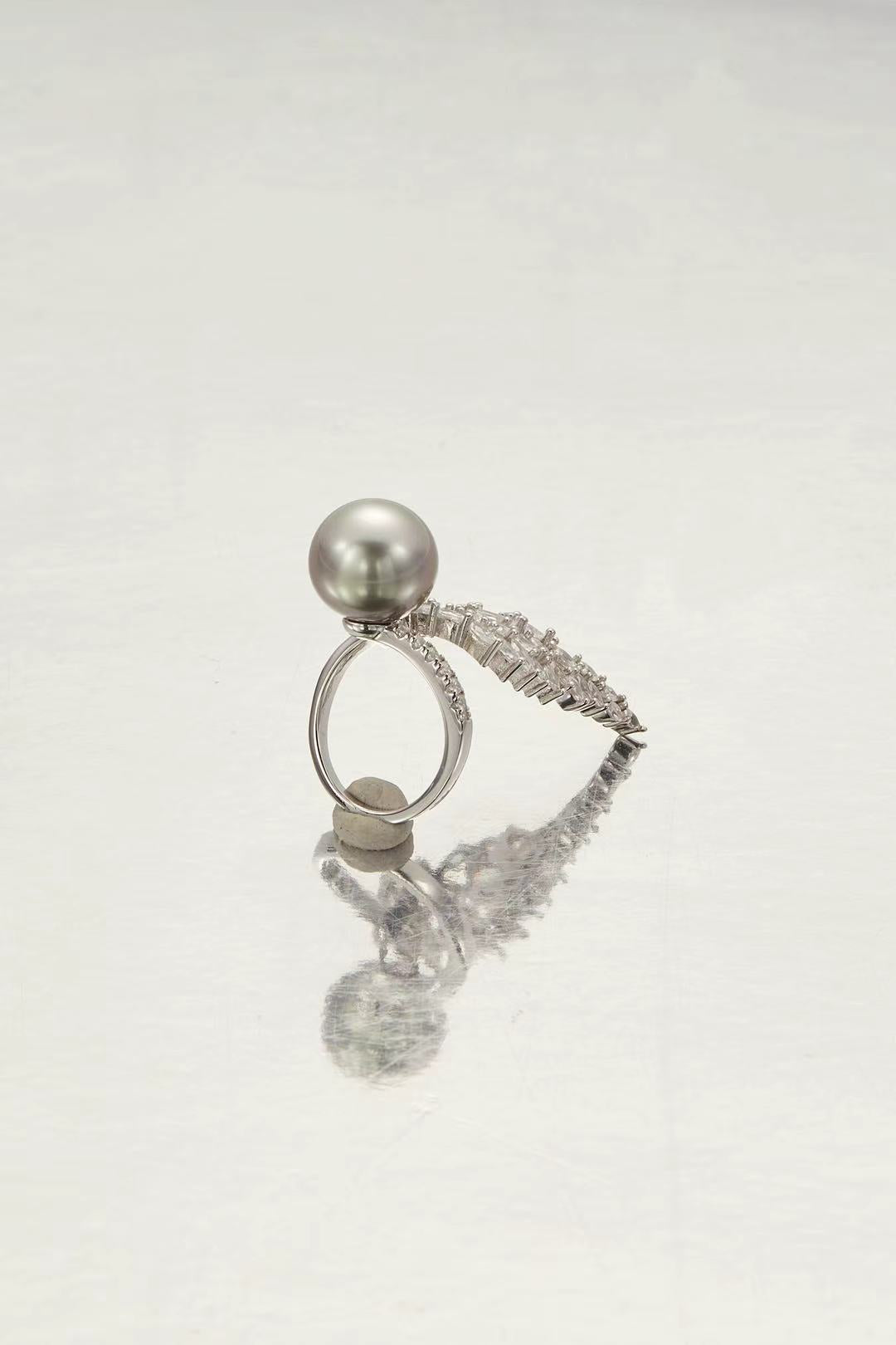 Fashion pearl with CZ wing silhouette close-up