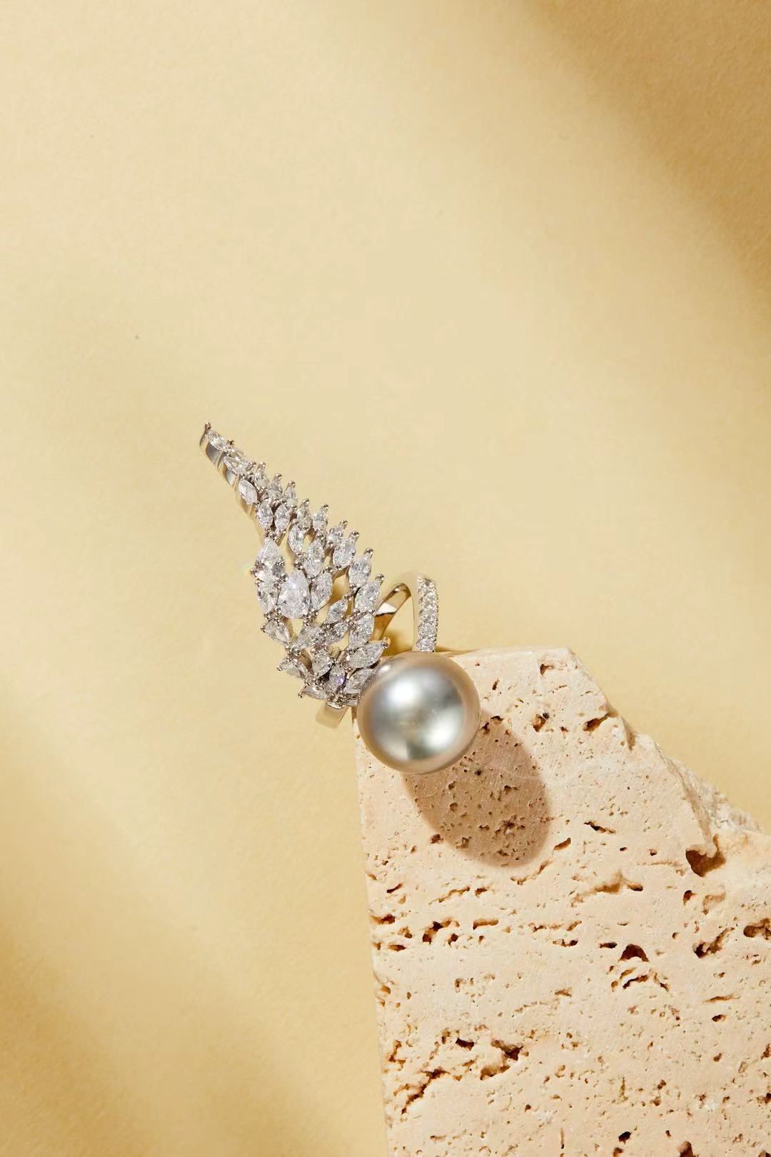 Fashion pearl with CZ wing silhouette close-up