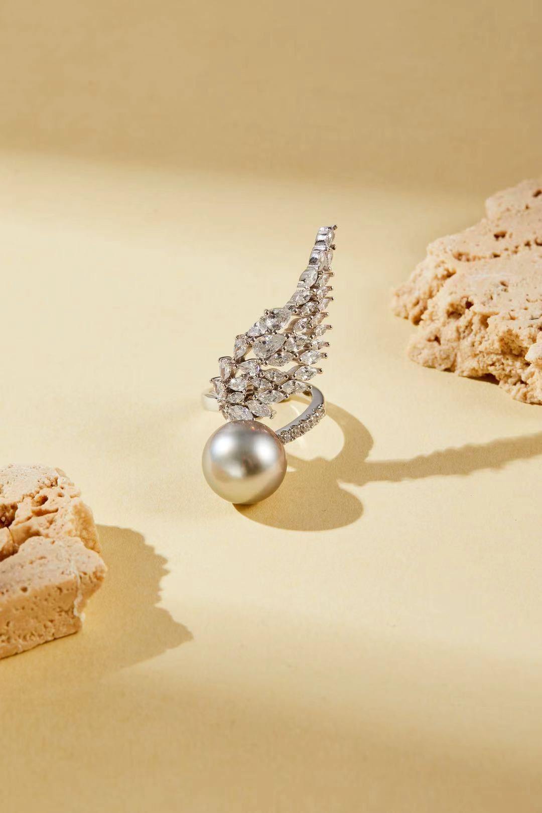 Fashion pearl with CZ wing silhouette close-up