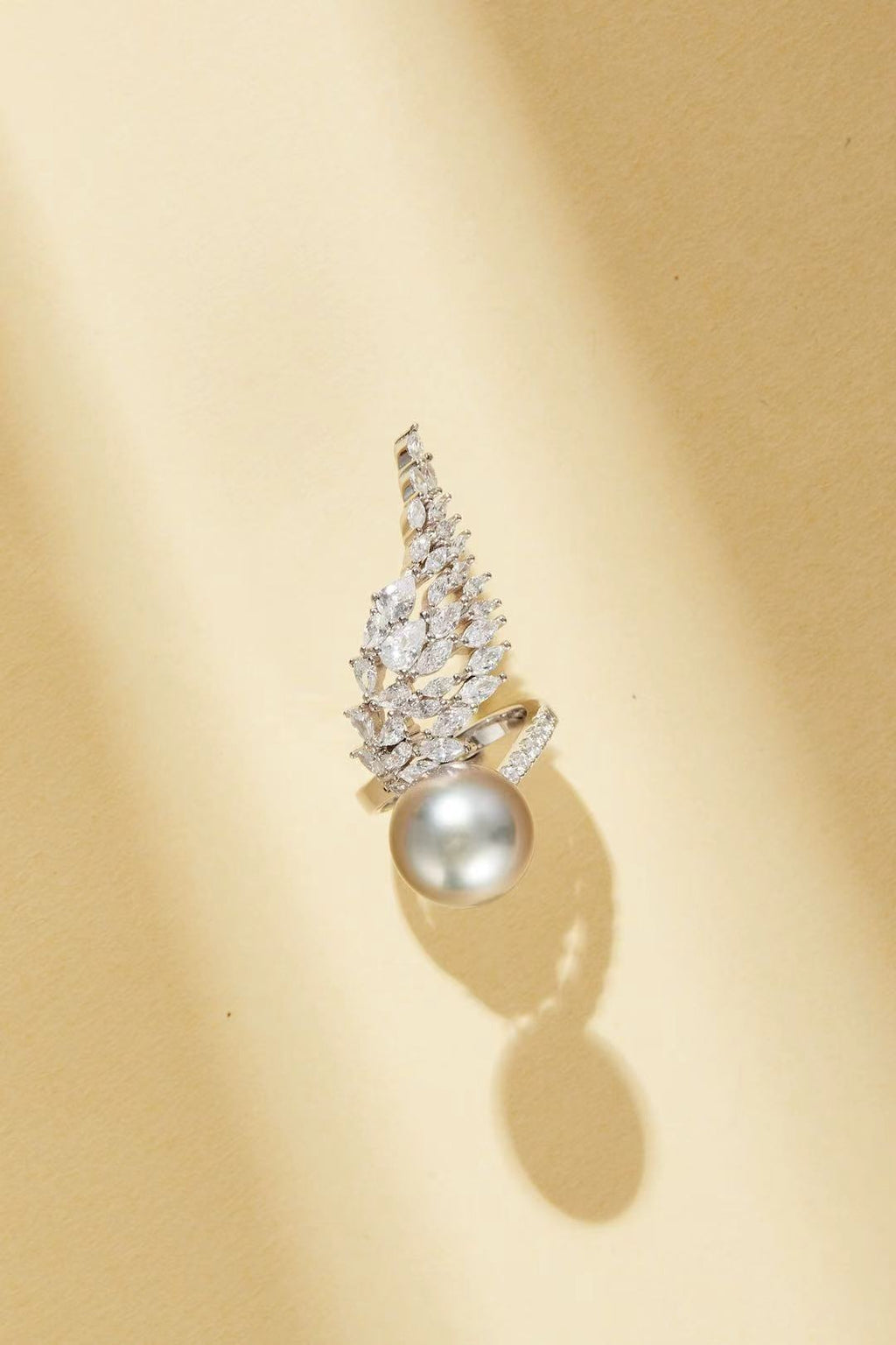 Fashion pearl with CZ wing silhouette close-up