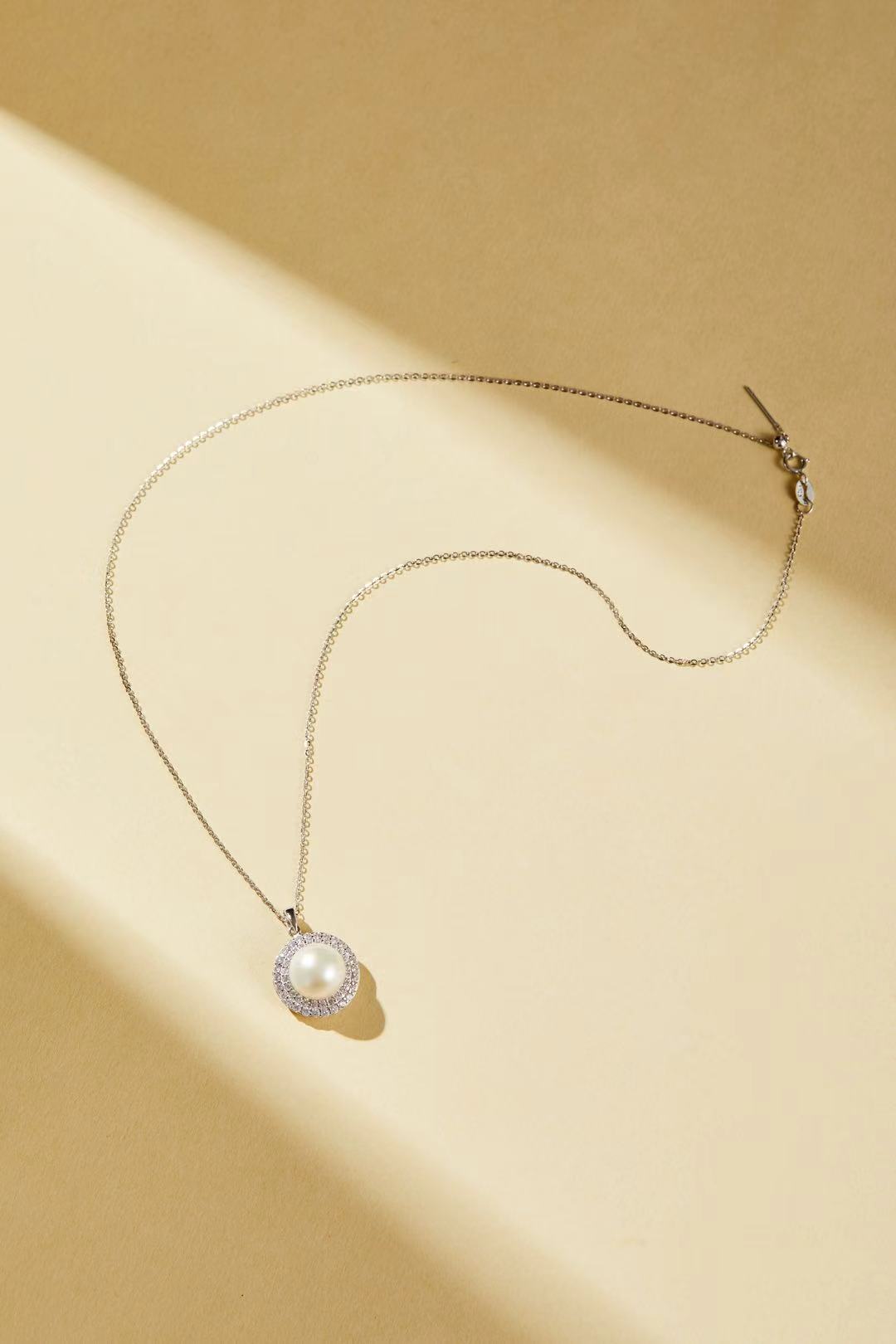 White fashion bead with sparkling cubic zirconia halo close-up