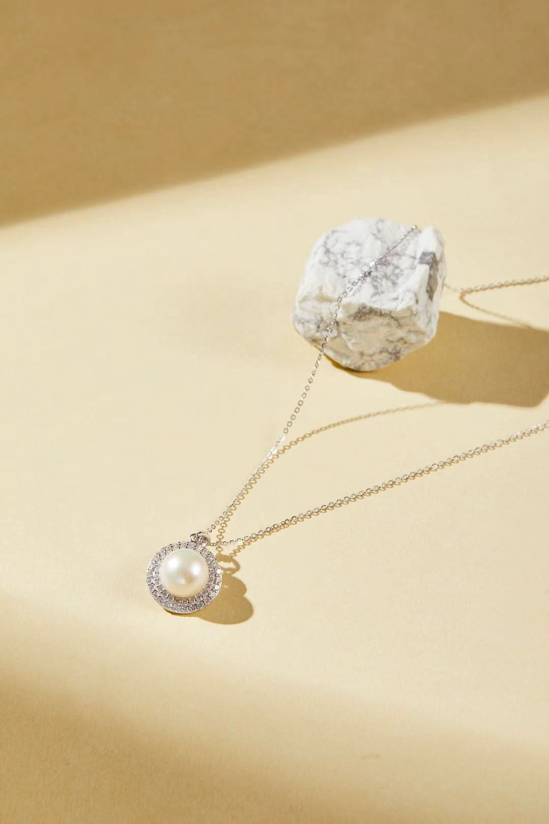 White fashion bead with sparkling cubic zirconia halo close-up