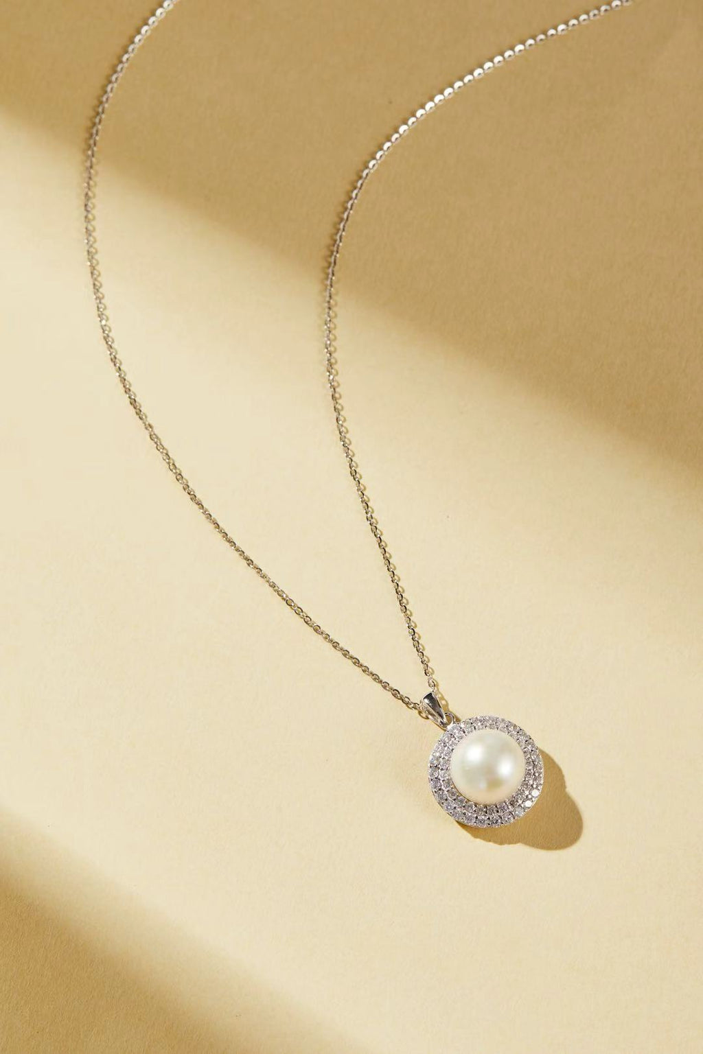 White fashion bead with sparkling cubic zirconia halo close-up